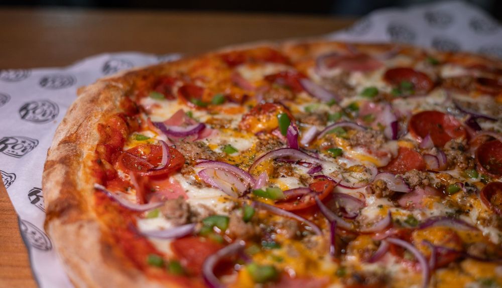 Pizza Canibal con cebolla y pimiento.