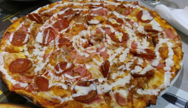 Pizza griega, una de las más populares de Barcapizza.